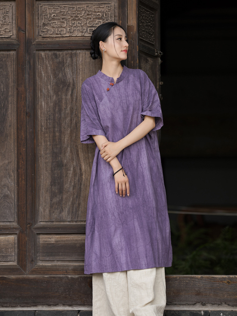 Woman wearing a purple traditional outfit standing Short Slevees 