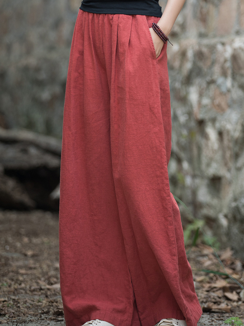 Person wearing red wide-leg pants 