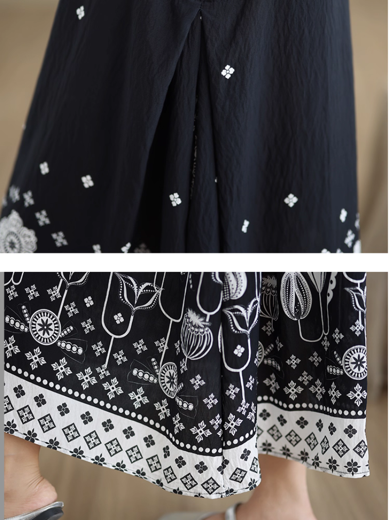 Black and white patterned fabric with floral and geometric designs.