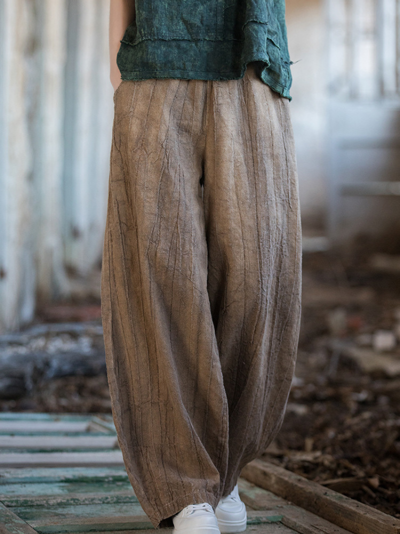 wearing brown wide-leg pants and a Brown shirt