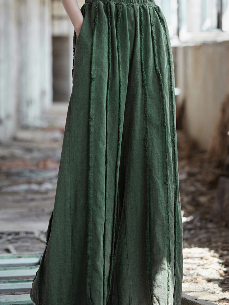  Green skirt worn by a Women's  in an outdoor setting