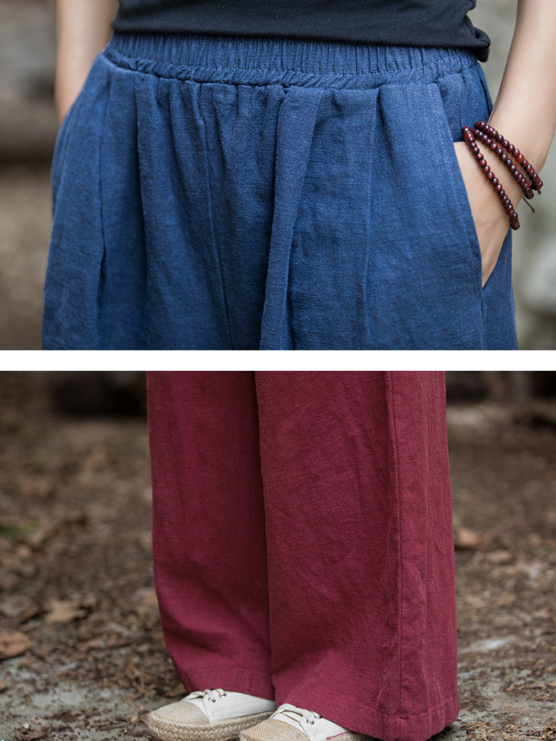 Two pairs of wide-leg pants in blue and red, worn outdoors.