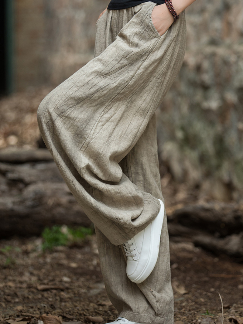  wearing Smoke Brwon wide-leg pants and 